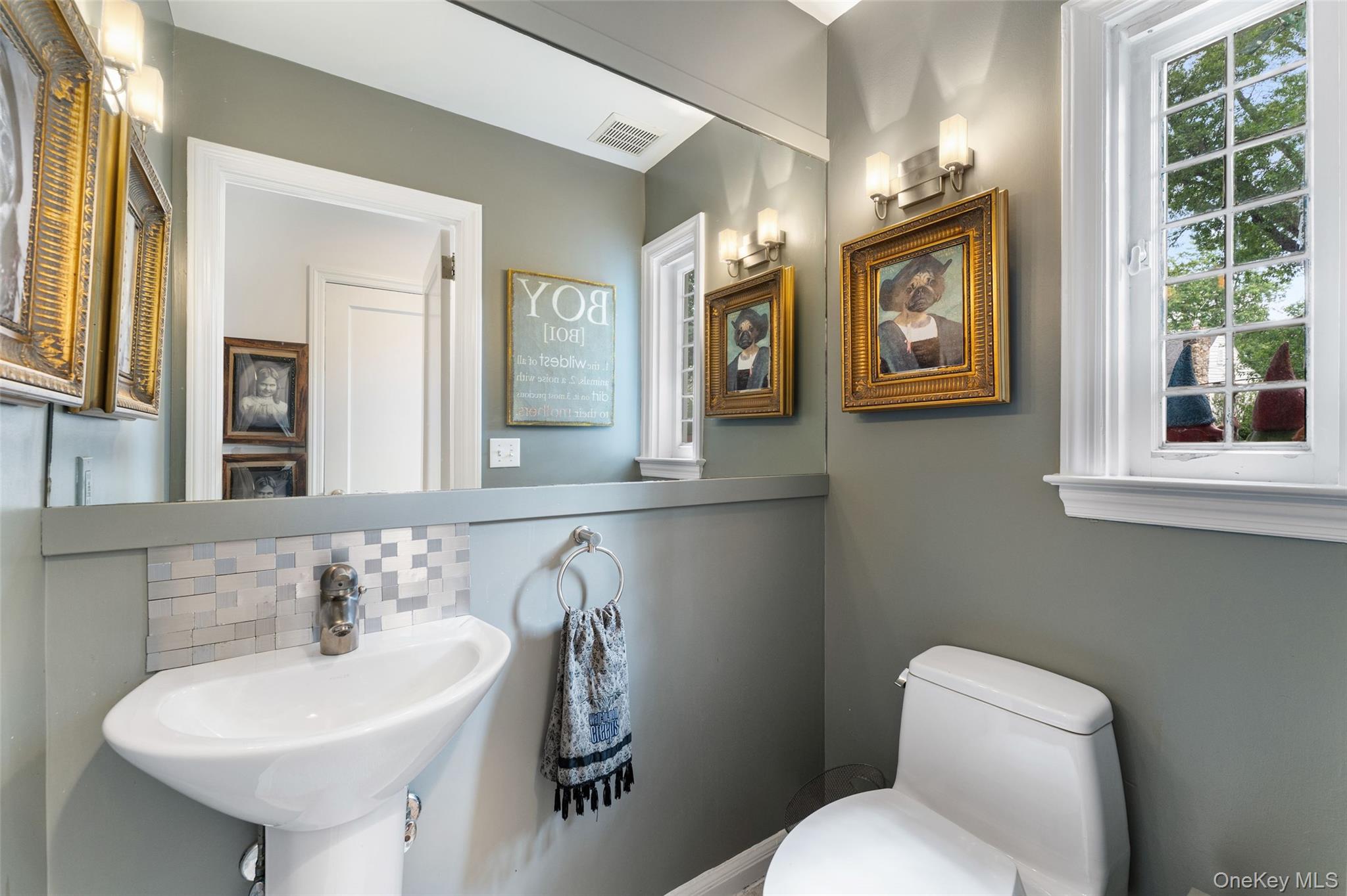 5 Coralyn Road Scarsdale, NY 10583 - Photo 16 of 44 a bathroom with a toilet sink and mirror