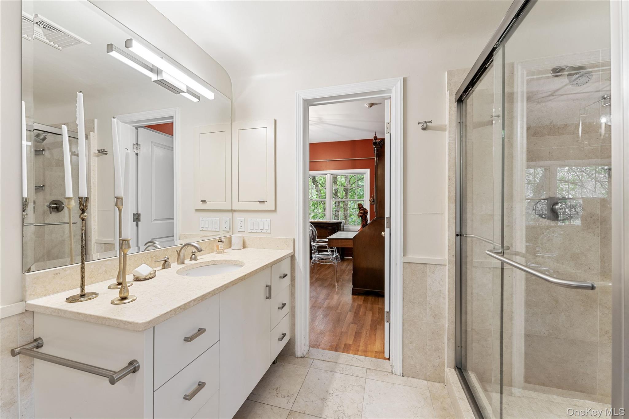 5 Coralyn Road Scarsdale, NY 10583 - Photo 21 of 44 a bathroom with a sink and a mirror