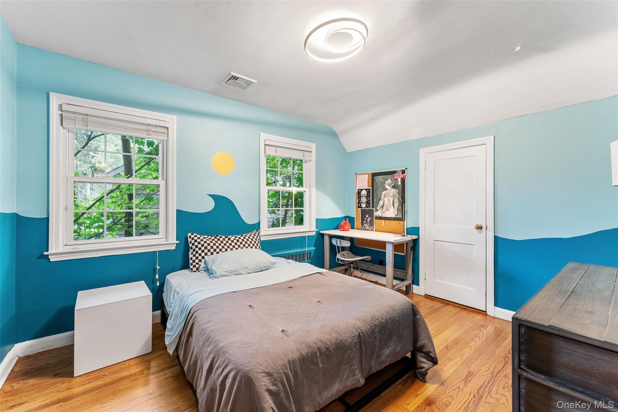 5 Coralyn Road Scarsdale, NY 10583 - Photo 22 of 44 a bedroom with a bed and a table in it