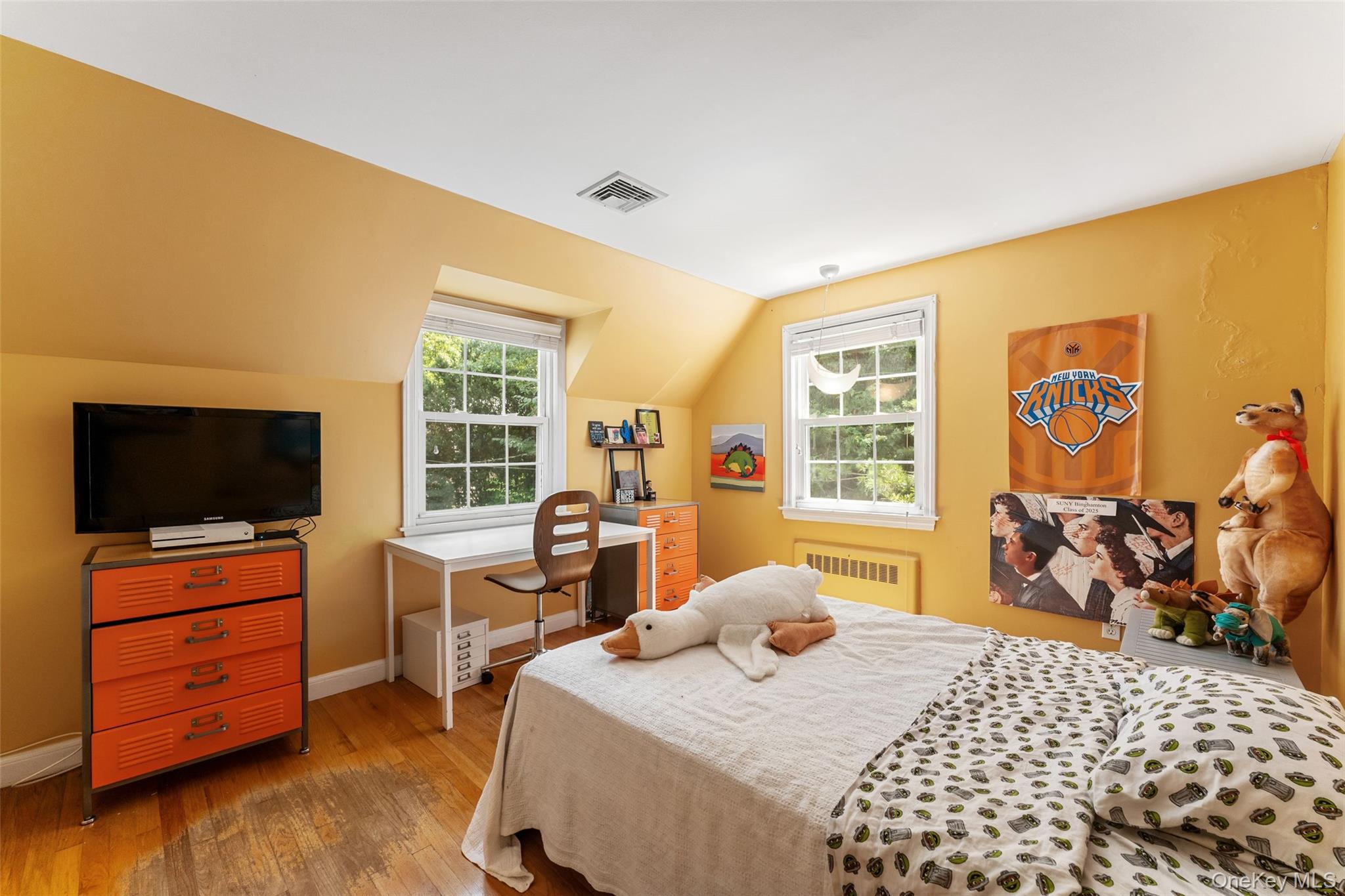 5 Coralyn Road Scarsdale, NY 10583 - Photo 24 of 44 a bedroom with a bed and wooden floor