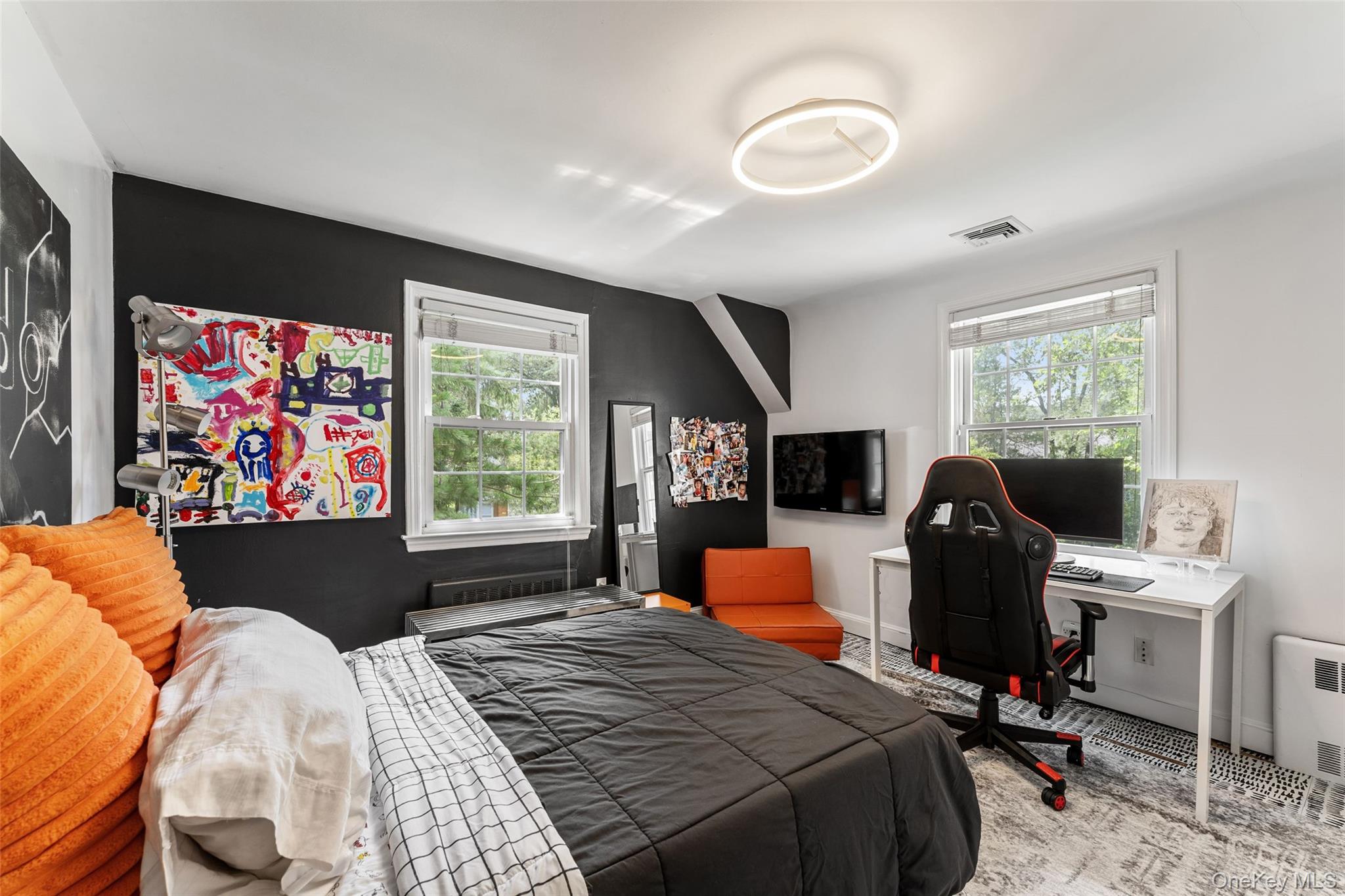 5 Coralyn Road Scarsdale, NY 10583 - Photo 25 of 44 a bedroom with a bed and a flat screen tv