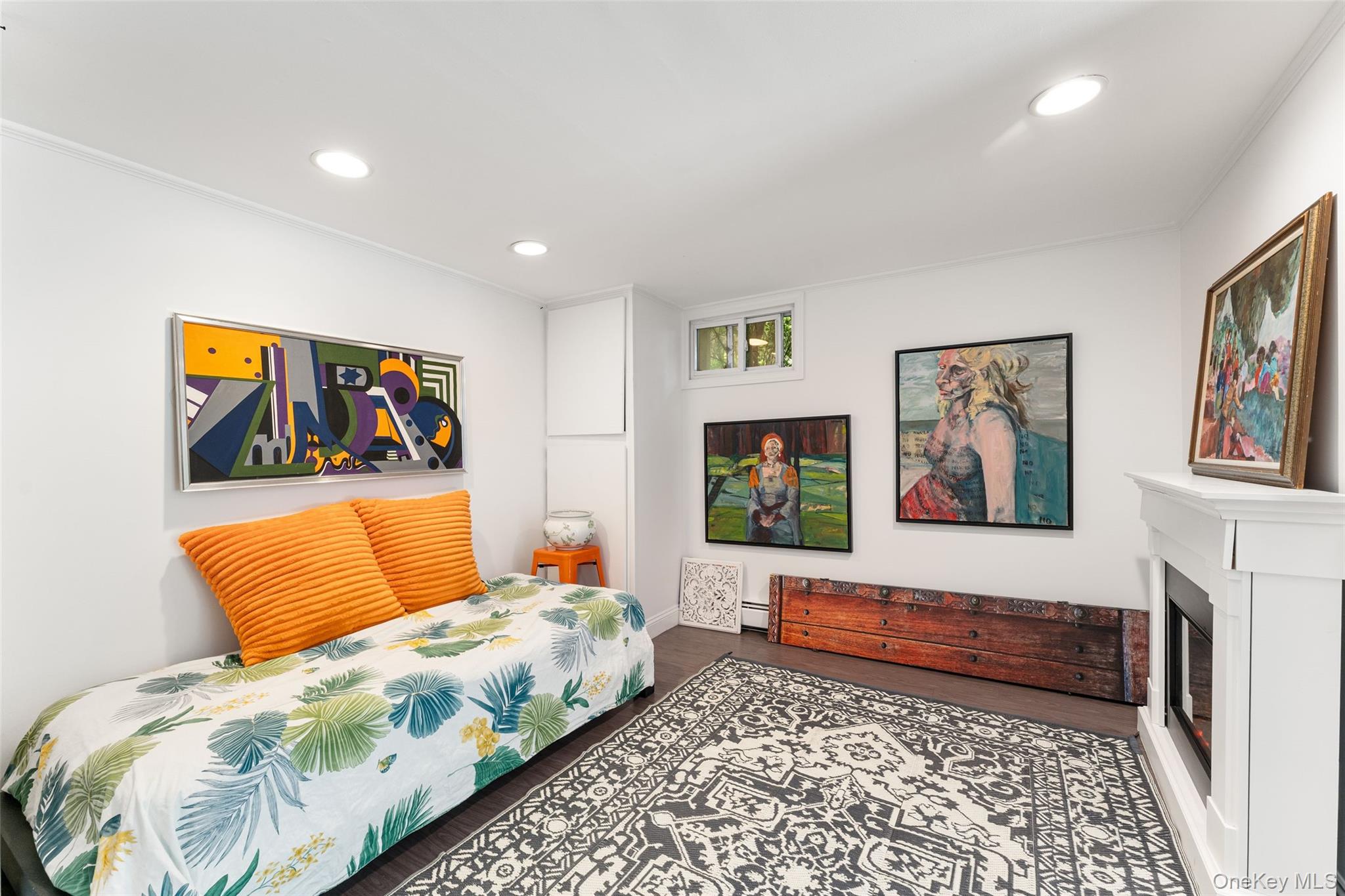 5 Coralyn Road Scarsdale, NY 10583 - Photo 27 of 44 a bedroom with a bed and a couch