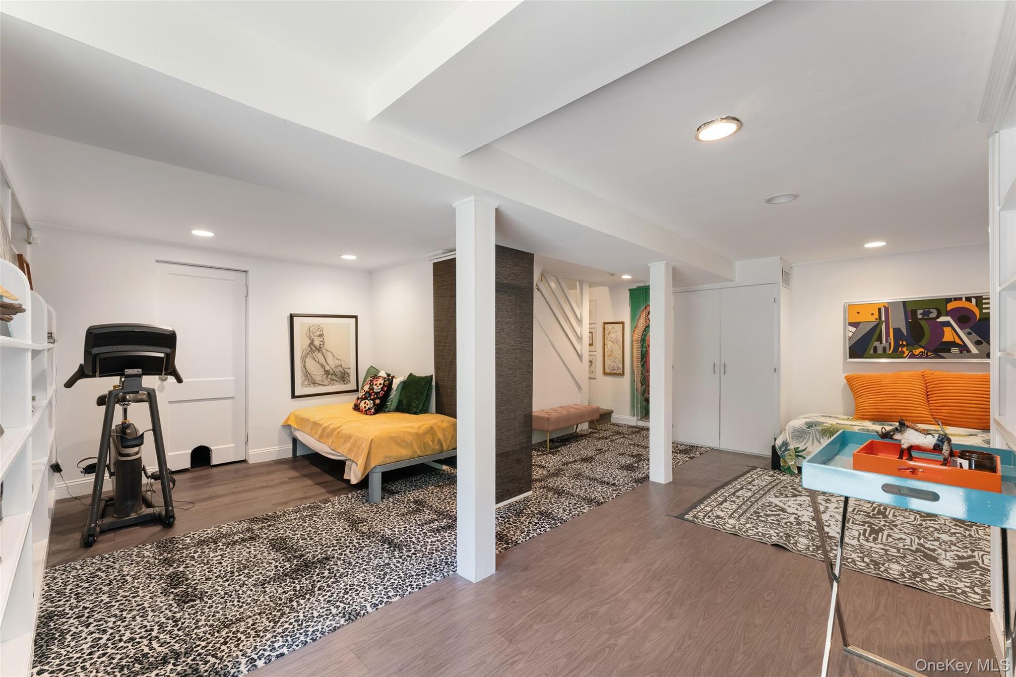 5 Coralyn Road Scarsdale, NY 10583 - Photo 30 of 44 a bedroom with furniture and a gym machine