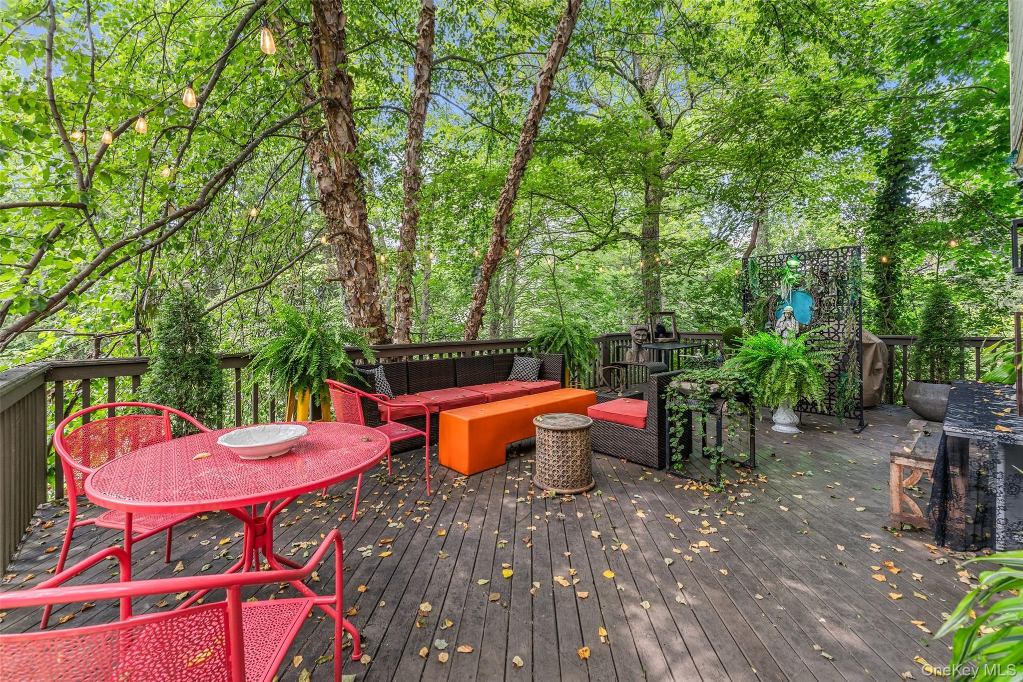5 Coralyn Road Scarsdale, NY 10583 - Photo 32 of 44 an outdoor sitting area with furniture and wooden floor