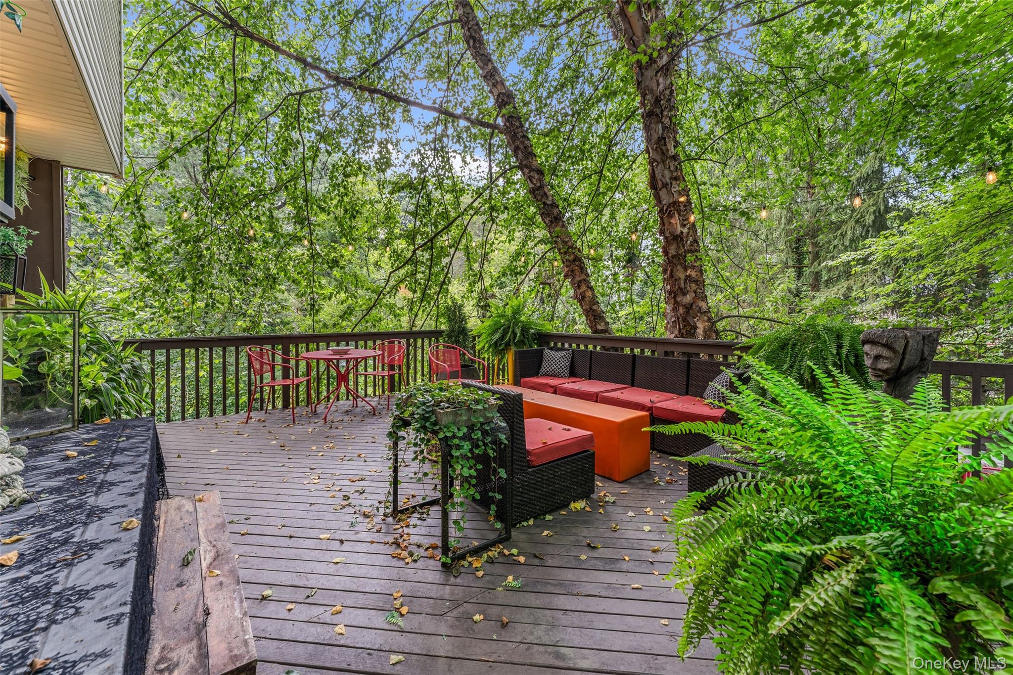 5 Coralyn Road Scarsdale, NY 10583 - Photo 33 of 44 a view of a bench in a patio