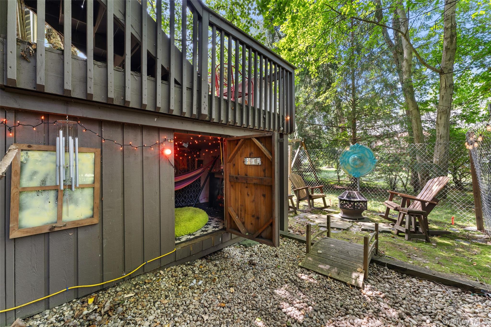 5 Coralyn Road Scarsdale, NY 10583 - Photo 36 of 44 a view of balcony with two chairs and a table