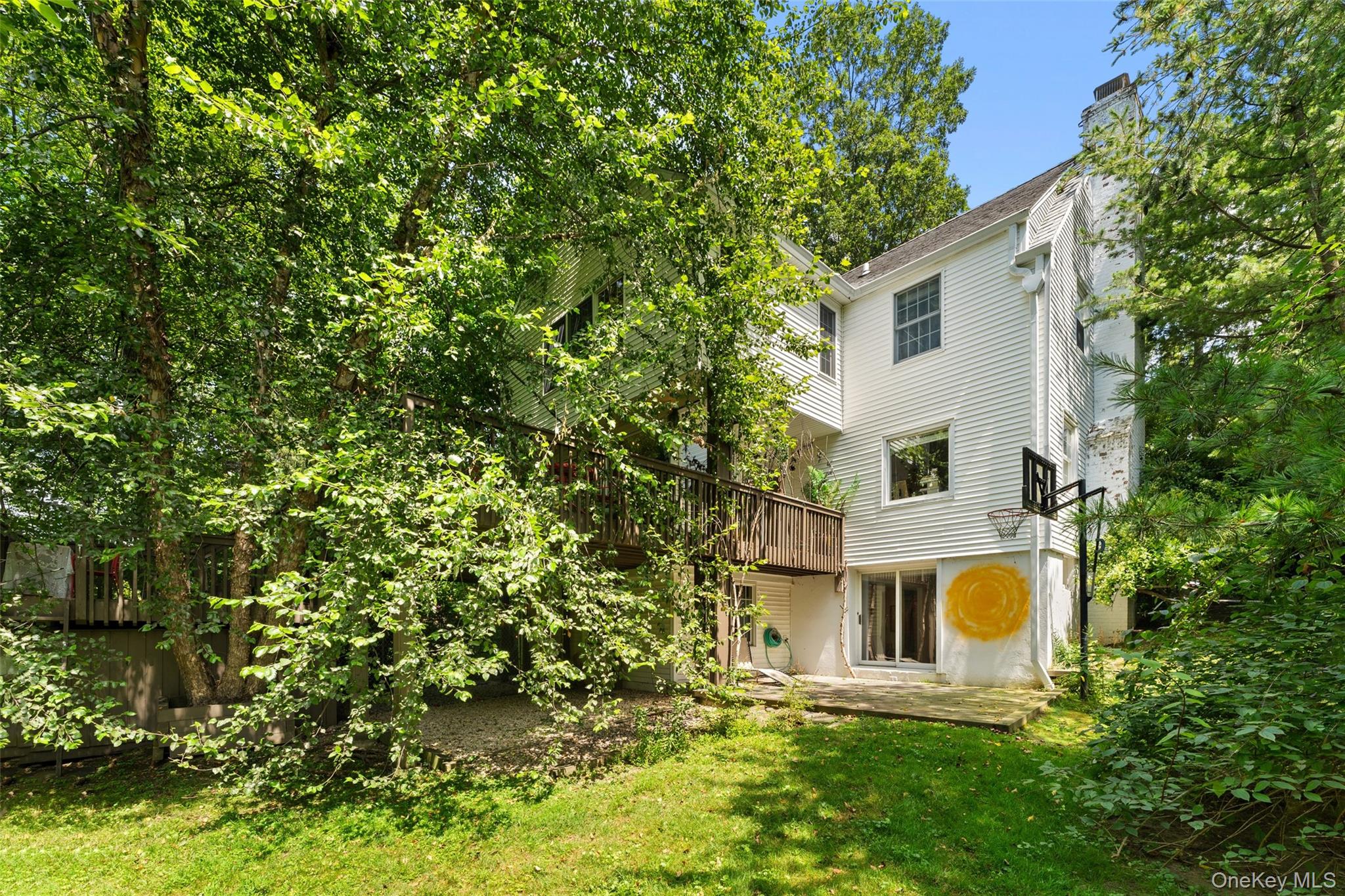 5 Coralyn Road Scarsdale, NY 10583 - Photo 40 of 44 a white building with a tree in front of it