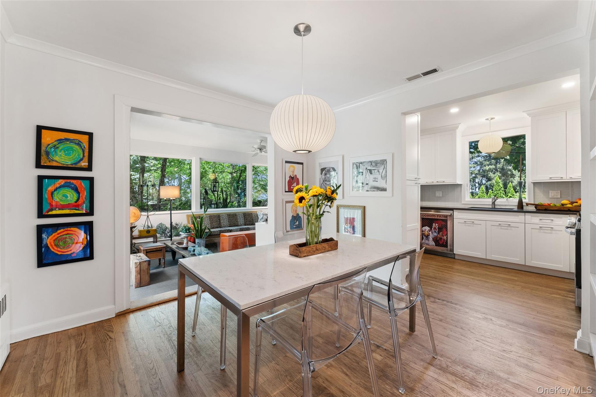 5 Coralyn Road Scarsdale, NY 10583 - Photo 8 of 44 a view of a dining room with furniture a chandelier and wooden floor