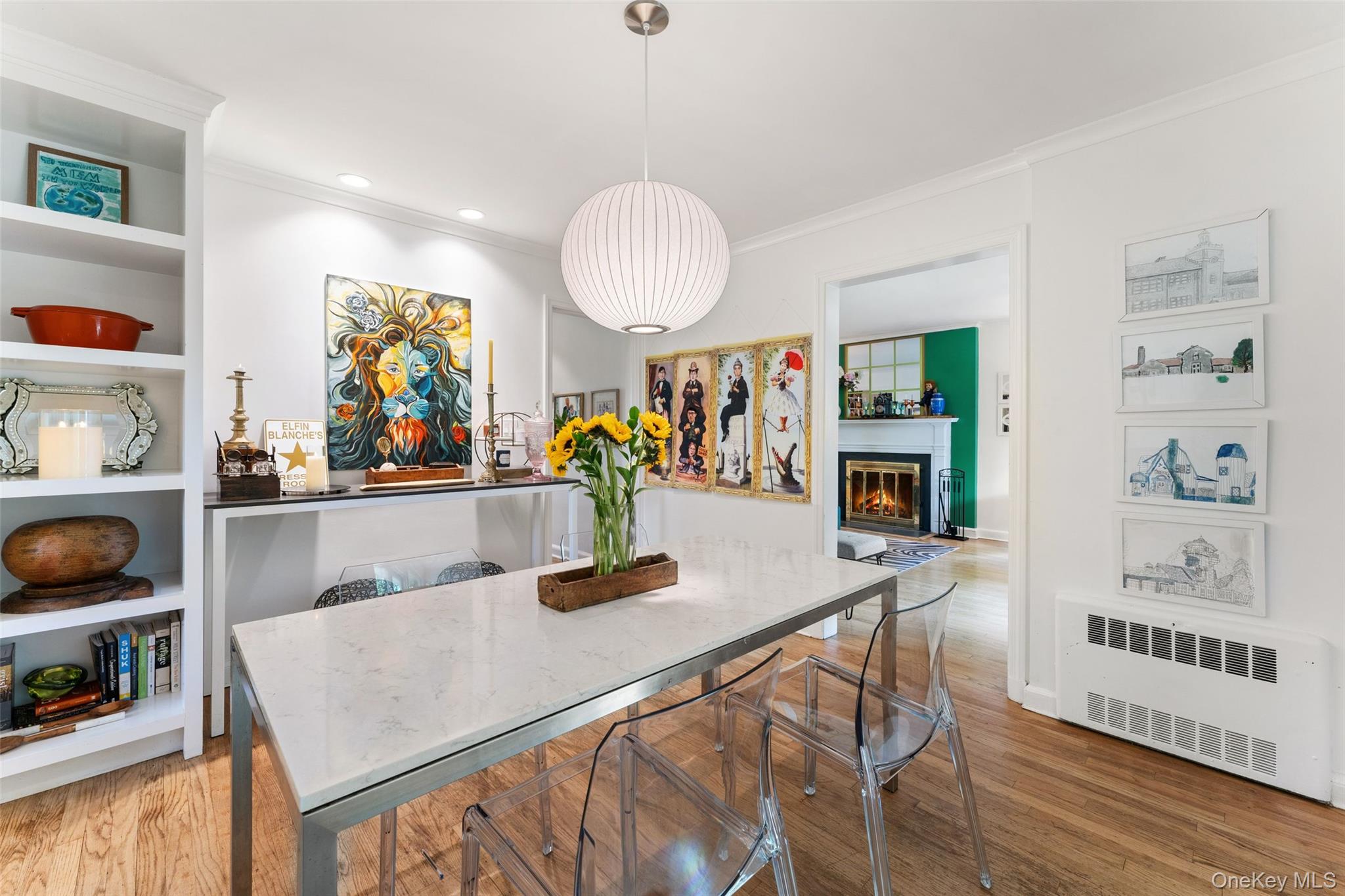 5 Coralyn Road Scarsdale, NY 10583 - Photo 9 of 44 a kitchen with stainless steel appliances granite countertop a stove a dining table and chairs with wooden floor