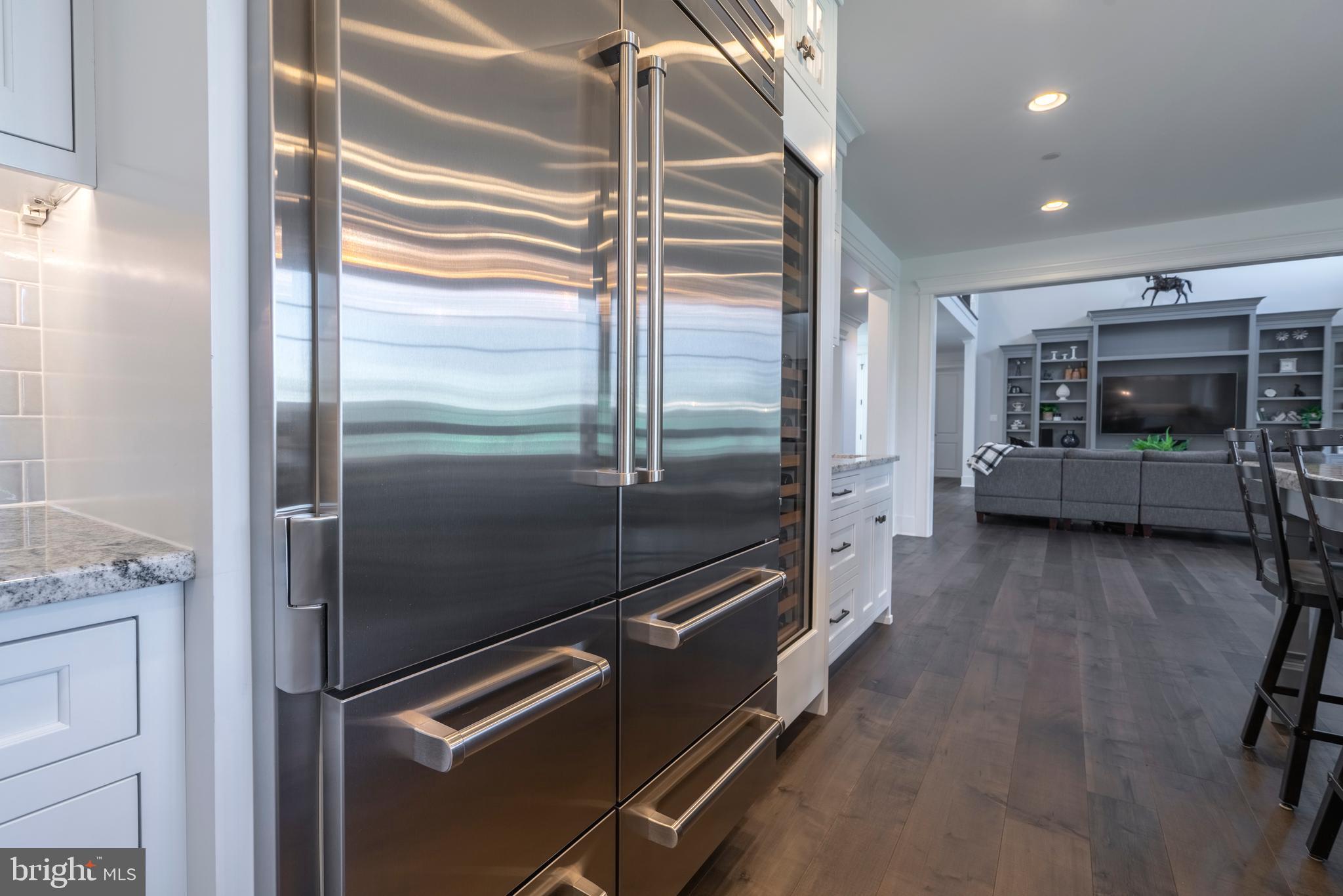 1161 Upper Stump Road Chalfont, PA 18914 - Photo 16 of 102 a kitchen with a refrigerator and a stove top oven