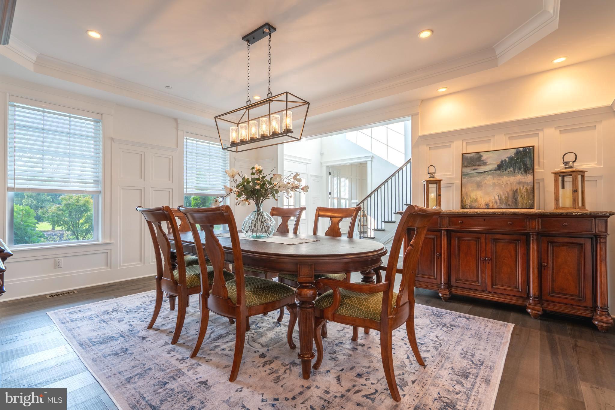 1161 Upper Stump Road Chalfont, PA 18914 - Photo 29 of 102 a dining room with furniture a chandelier and wooden floor