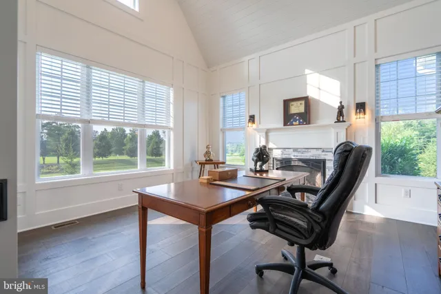 a view of hallway with wooden floor