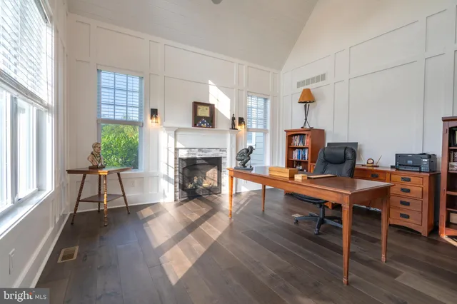 a bedroom with a bed dresser and a window