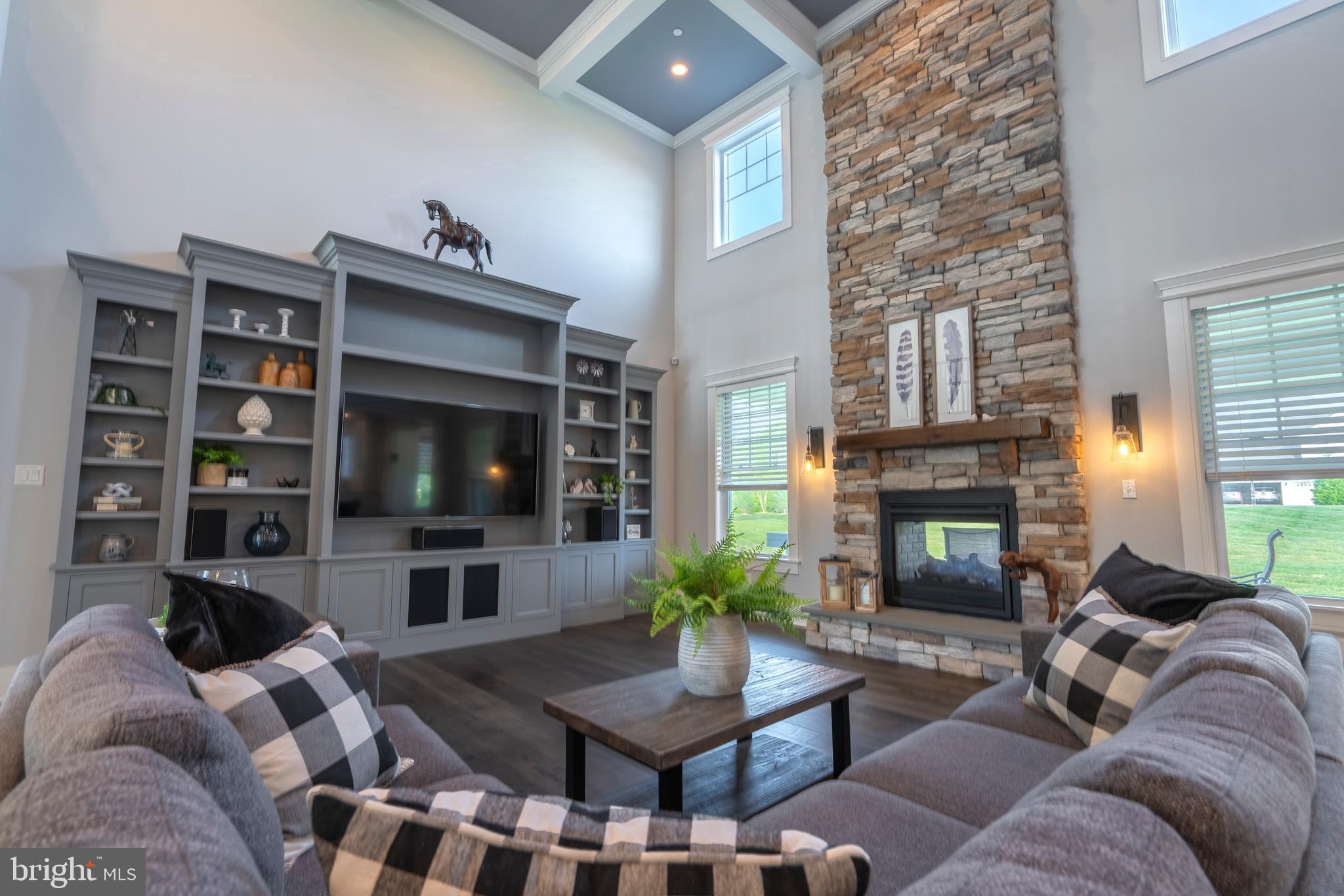 1161 Upper Stump Road Chalfont, PA 18914 - Photo 5 of 102 a living room with furniture a flat screen tv and a fireplace