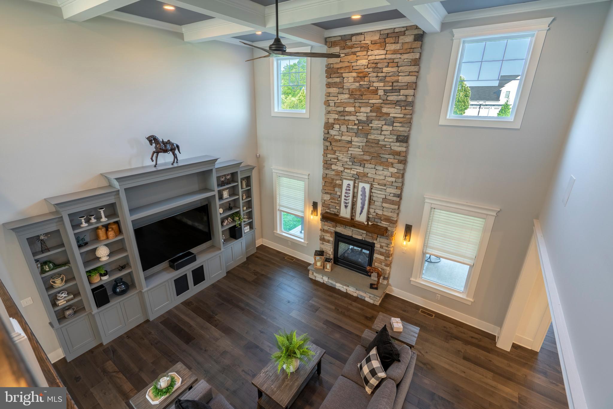 1161 Upper Stump Road Chalfont, PA 18914 - Photo 7 of 102 a living room with furniture a fireplace and a flat screen tv