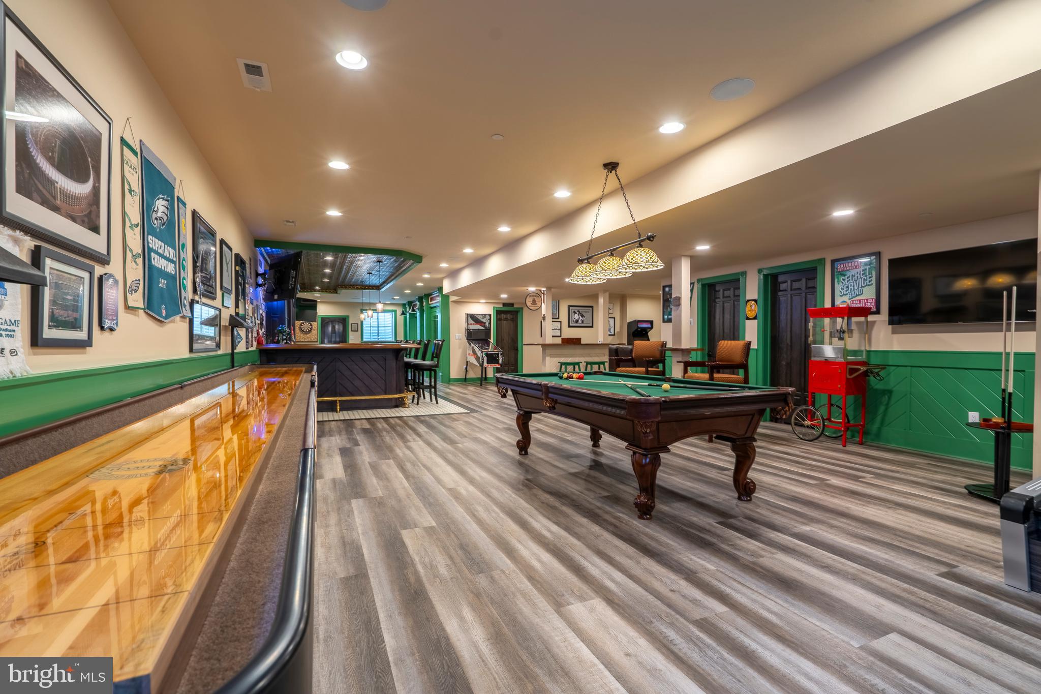 1161 Upper Stump Road Chalfont, PA 18914 - Photo 76 of 102 a living room with furniture a flat screen tv and a wooden floor
