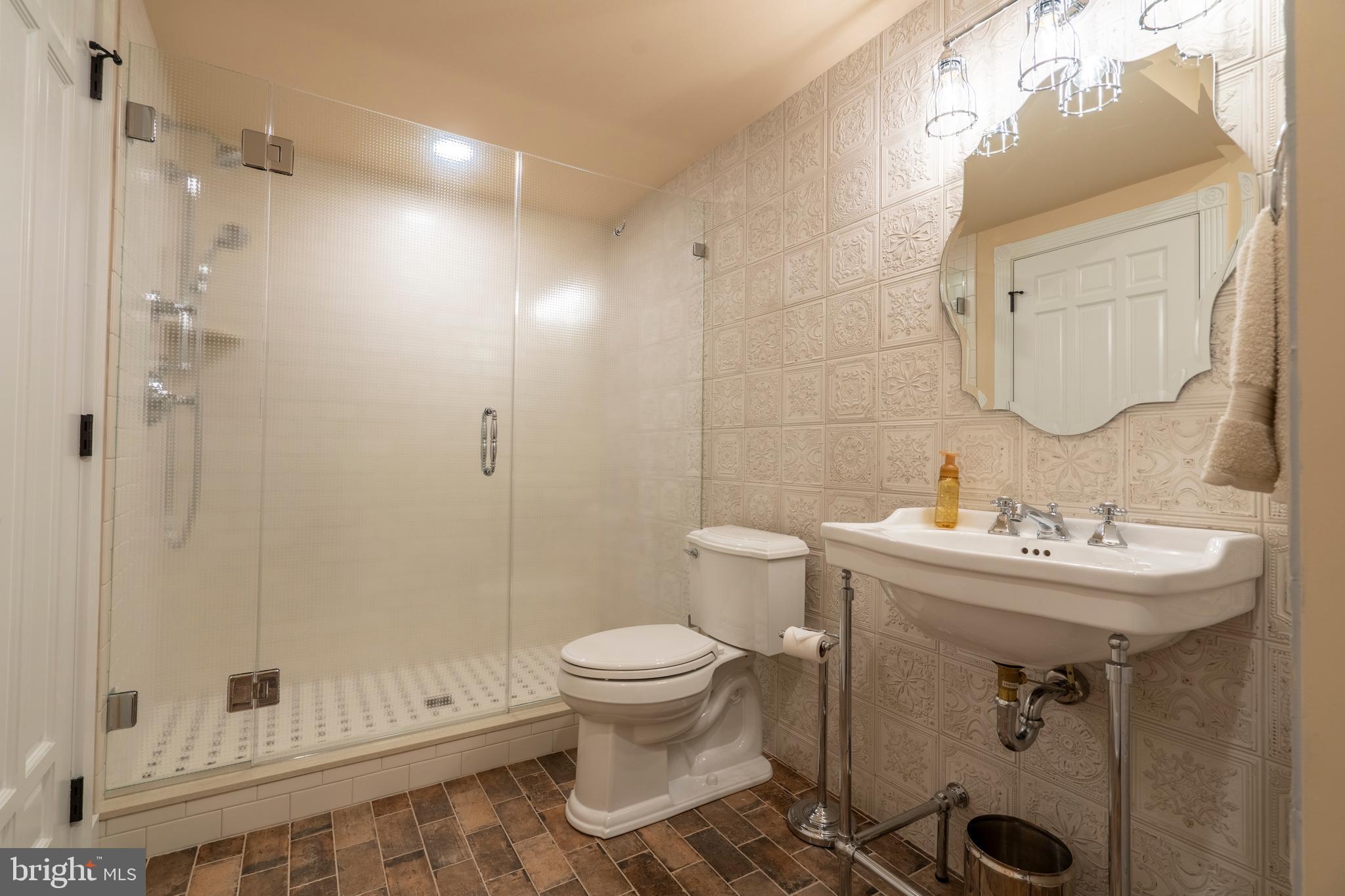 1161 Upper Stump Road Chalfont, PA 18914 - Photo 84 of 102 a bathroom with a sink toilet and shower