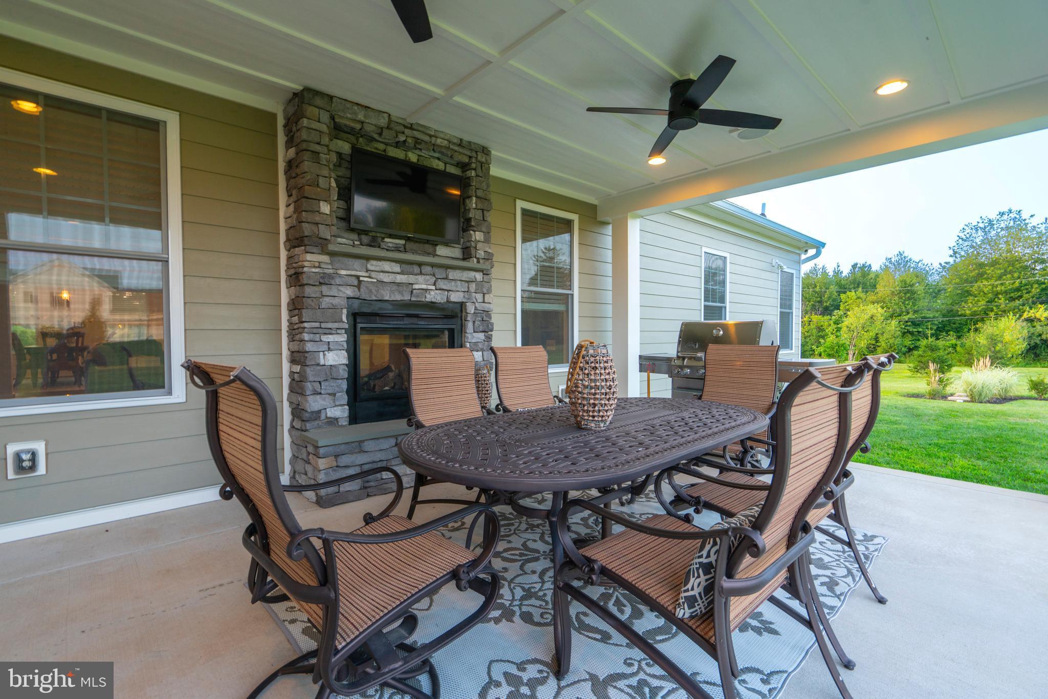 1161 Upper Stump Road Chalfont, PA 18914 - Photo 88 of 102 a view of a patio with a table and chairs