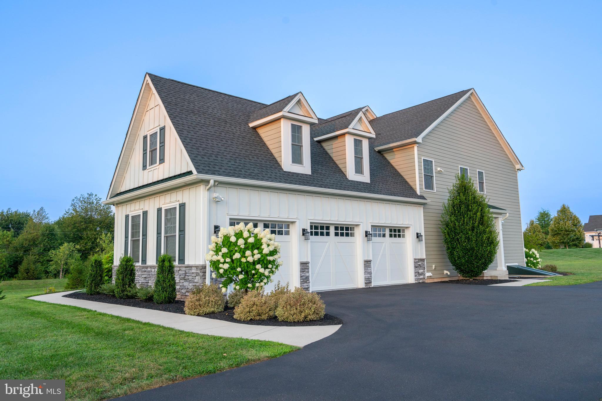1161 Upper Stump Road Chalfont, PA 18914 - Photo 95 of 102 a front view of a house with a yard and garage