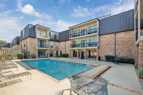 a view of a house with swimming pool