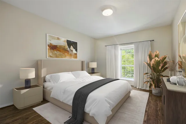 a bedroom with a bed and a couch