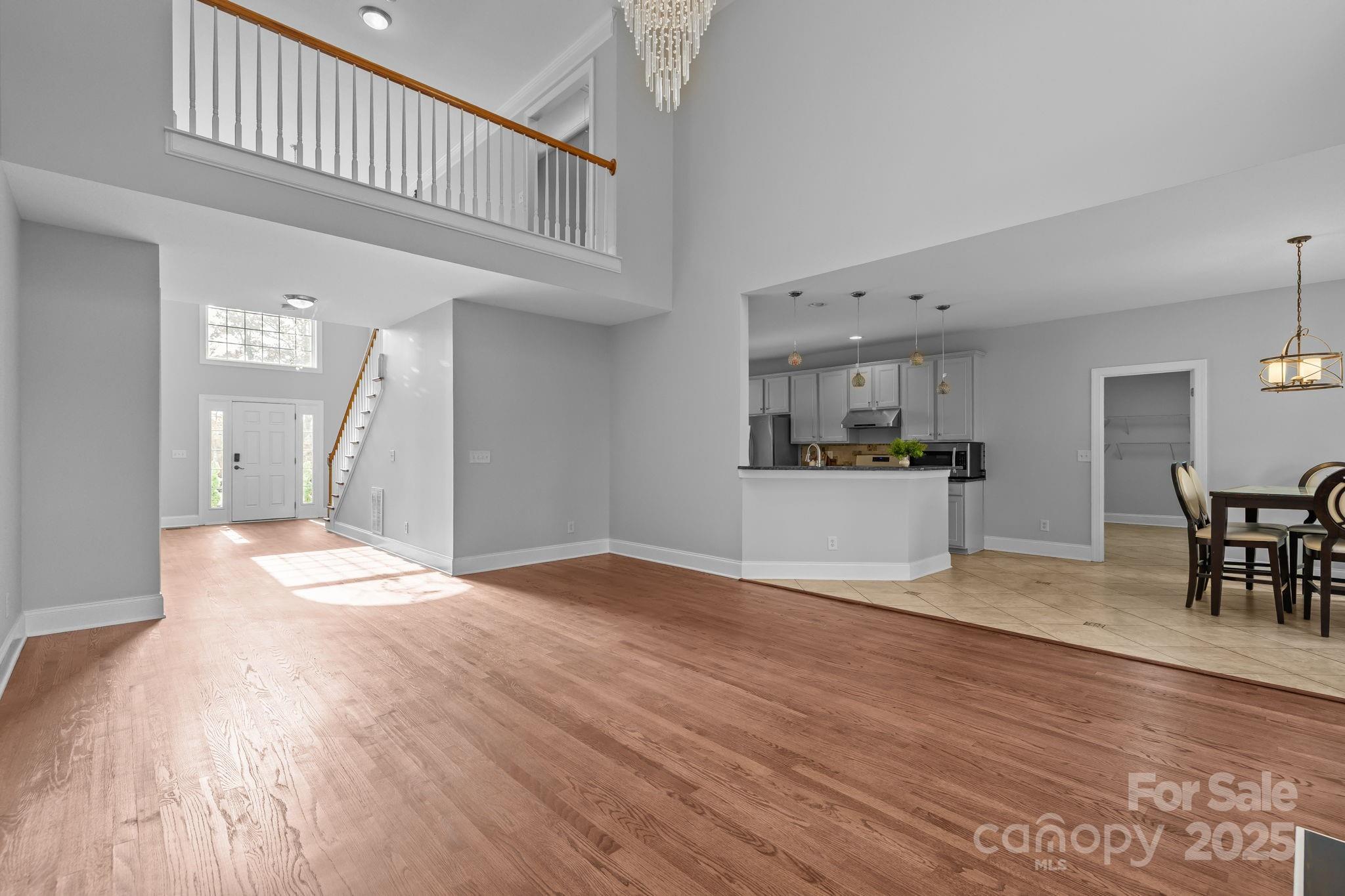 4424 Sunset Rose Drive Fort Mill, SC 29708 - Photo 16 of 47 a view of empty room with wooden floor and furniture