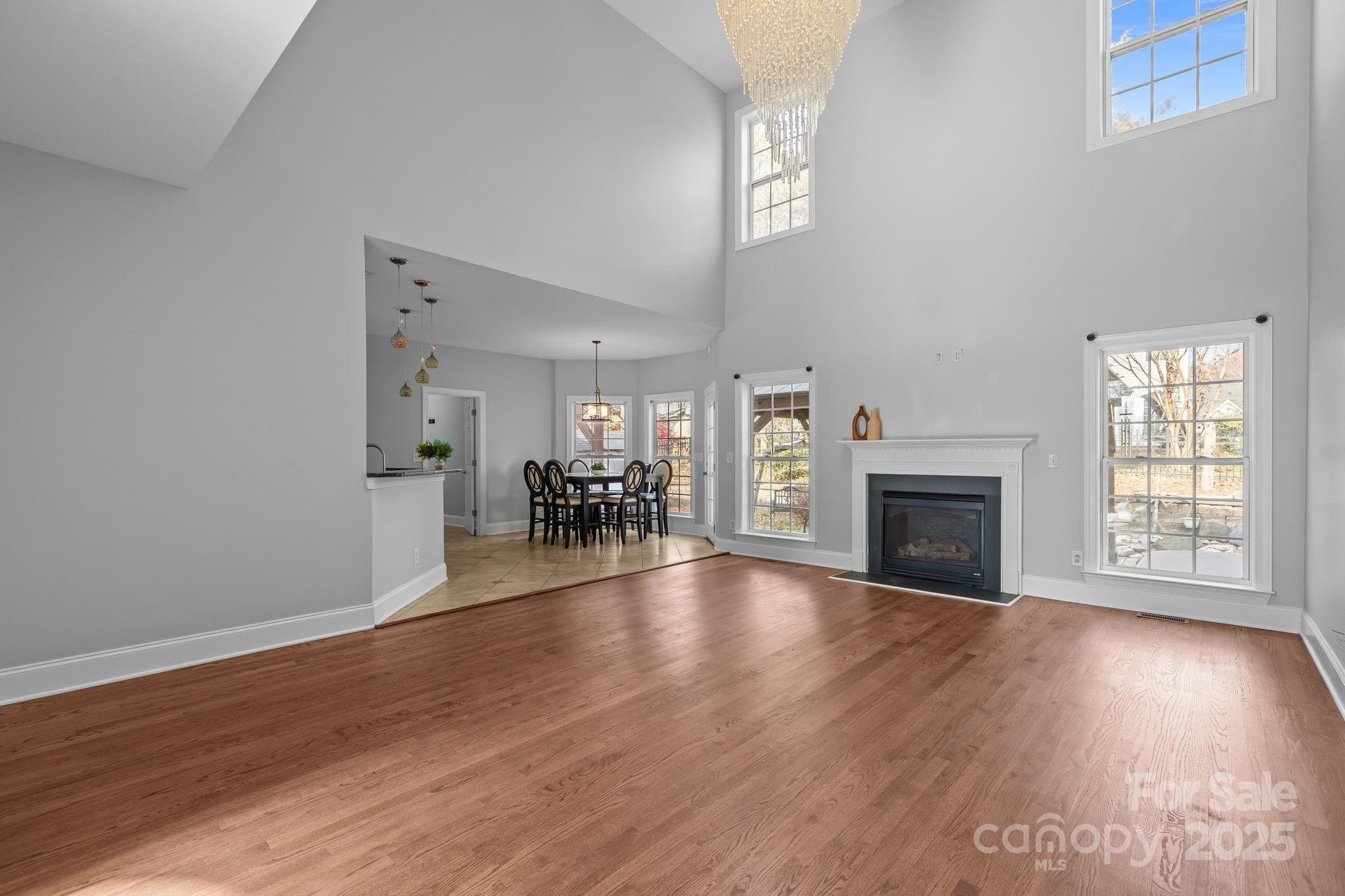 4424 Sunset Rose Drive Fort Mill, SC 29708 - Photo 17 of 47 a view of an empty room with wooden floor and a window