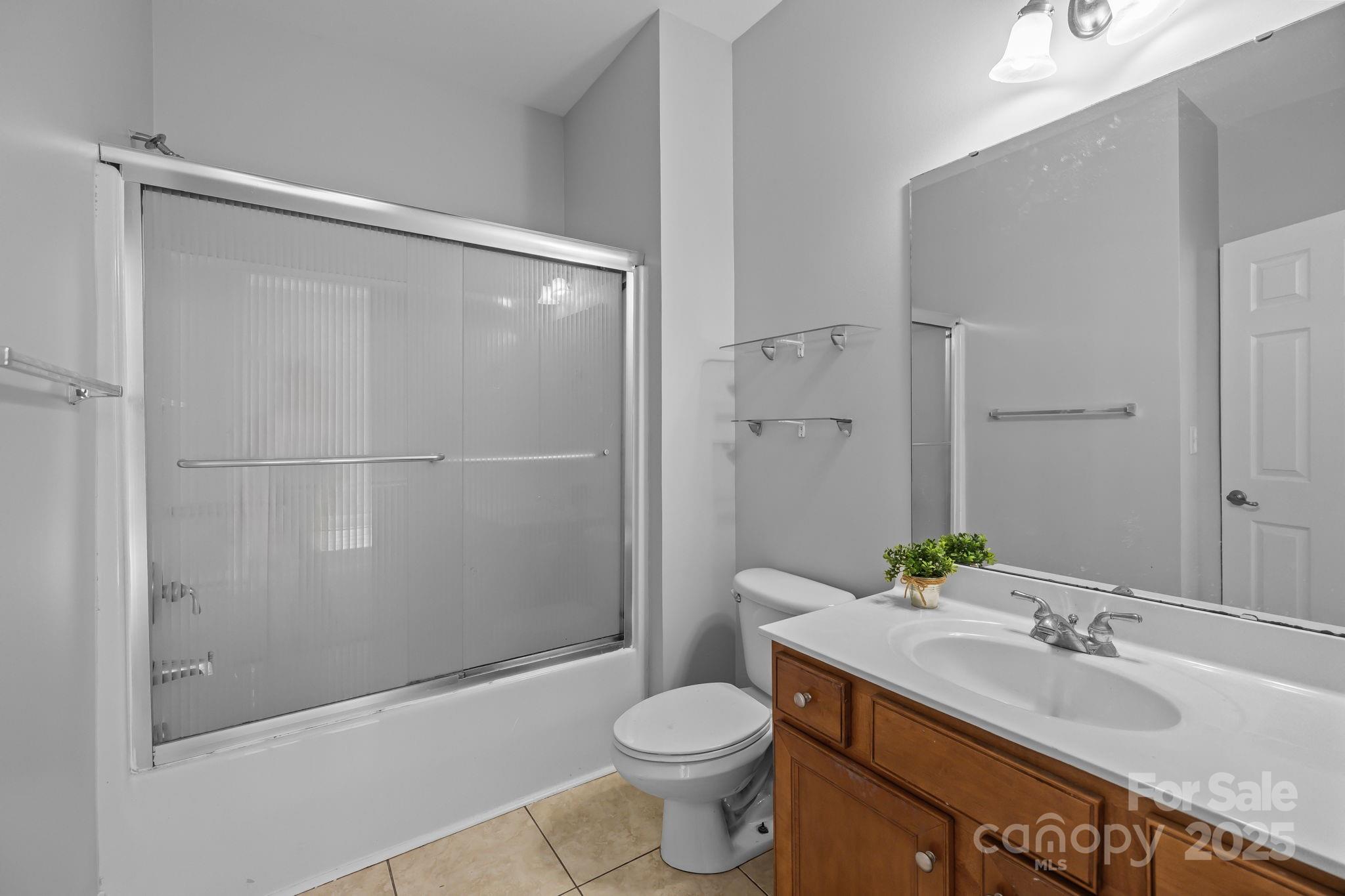 4424 Sunset Rose Drive Fort Mill, SC 29708 - Photo 20 of 47 a bathroom with a granite countertop sink toilet and shower