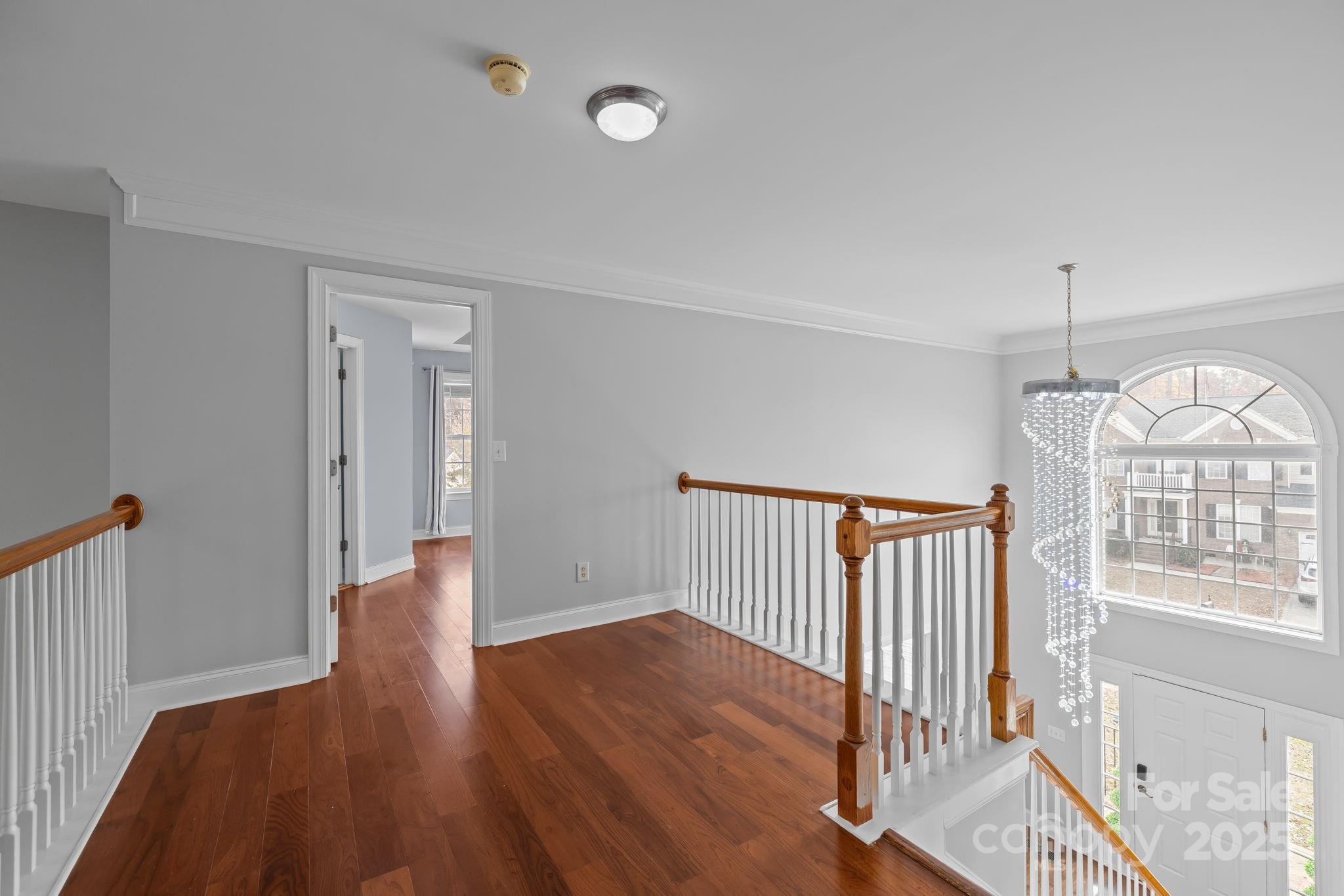 4424 Sunset Rose Drive Fort Mill, SC 29708 - Photo 21 of 47 a view of an empty room with wooden floor and a window