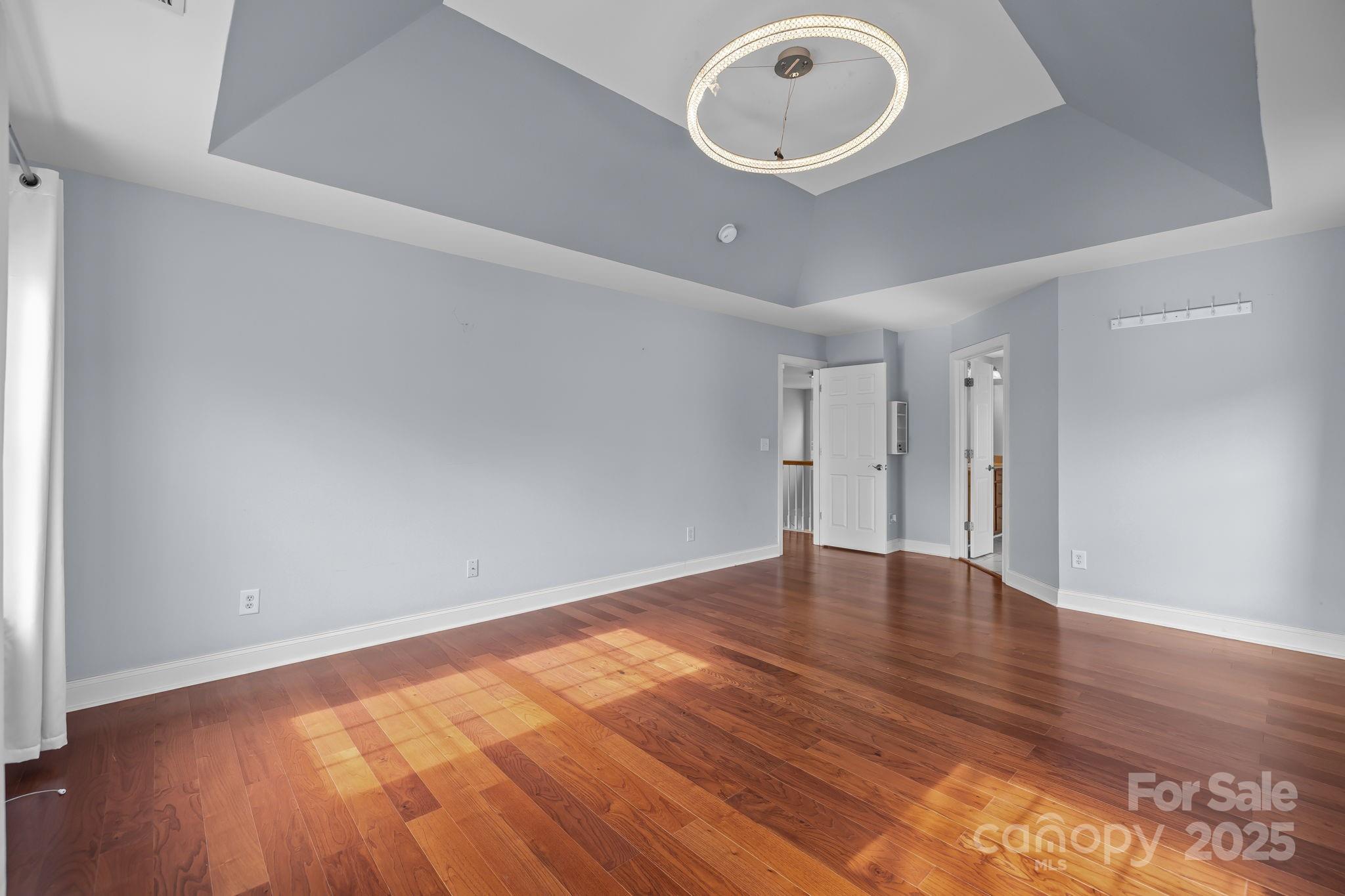 4424 Sunset Rose Drive Fort Mill, SC 29708 - Photo 23 of 47 a view of an empty room with wooden floor and a window