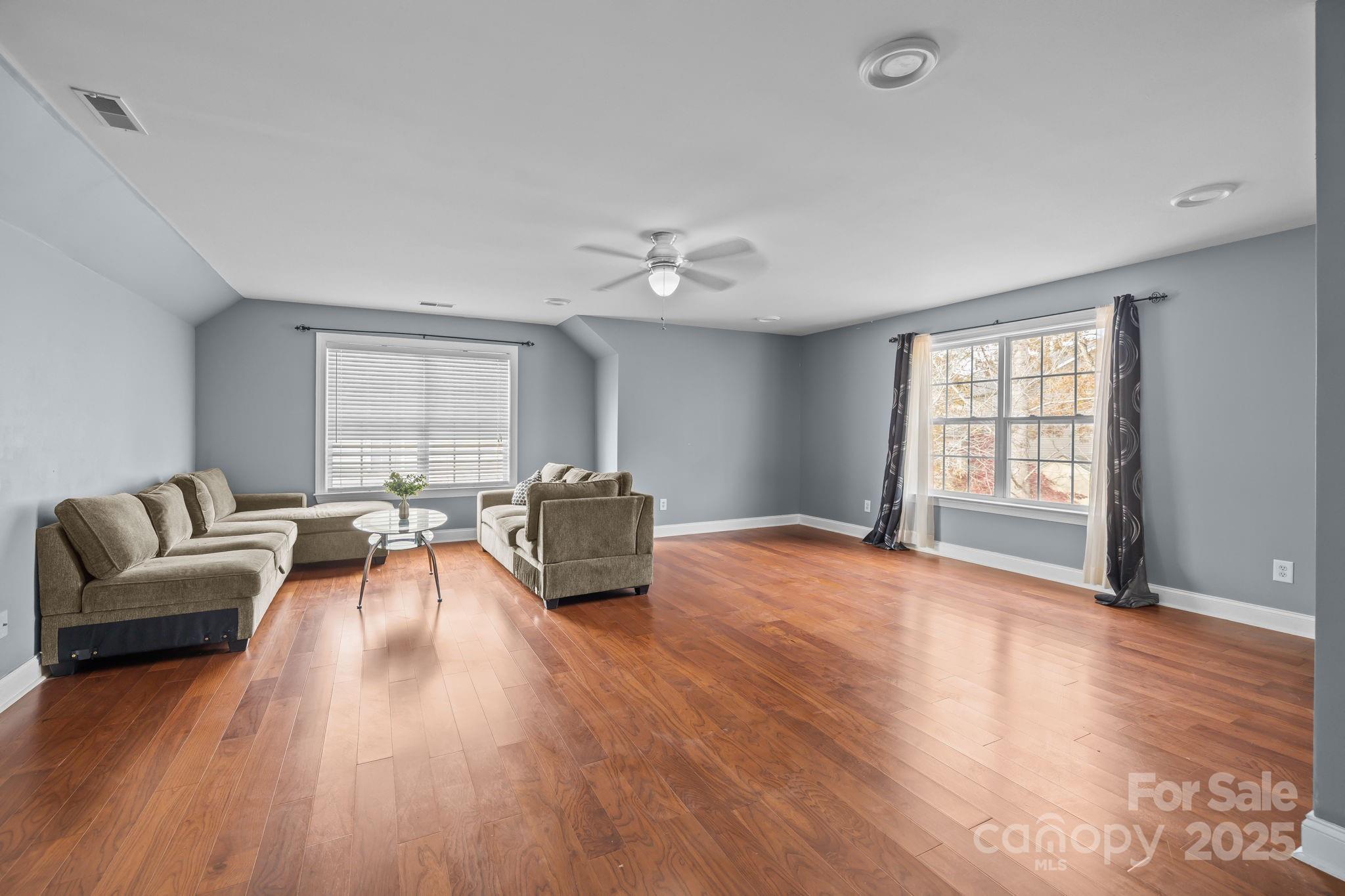 4424 Sunset Rose Drive Fort Mill, SC 29708 - Photo 31 of 47 a living room with furniture and a large window