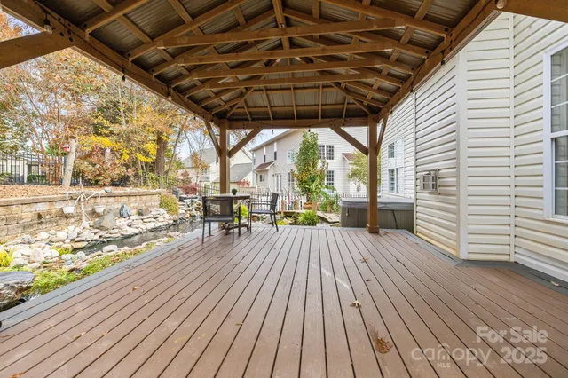 a view of a patio with table and chairs and wooden floor