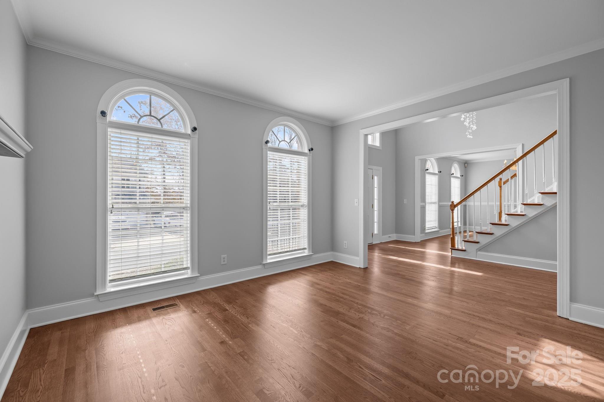 4424 Sunset Rose Drive Fort Mill, SC 29708 - Photo 4 of 47 a view of an empty room with wooden floor and a window