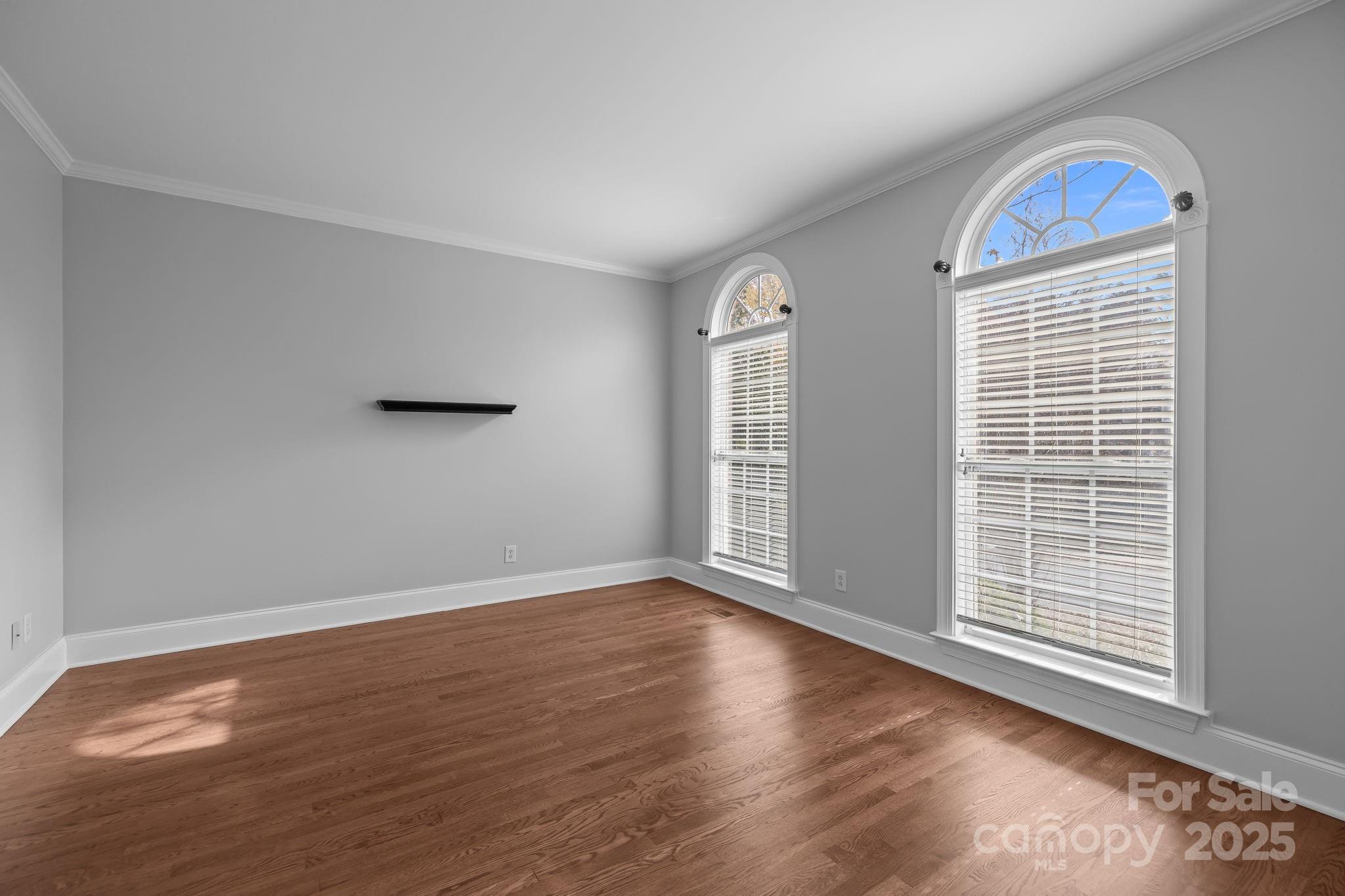 4424 Sunset Rose Drive Fort Mill, SC 29708 - Photo 7 of 47 a view of an empty room with wooden floor and a window