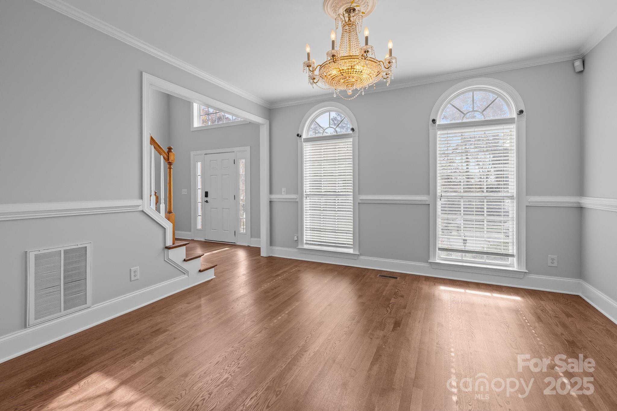 4424 Sunset Rose Drive Fort Mill, SC 29708 - Photo 8 of 47 wooden floor in an empty room with a window