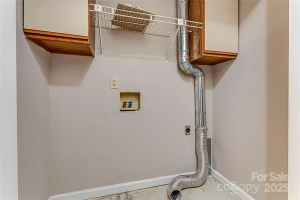 view of a room with rack on the wall