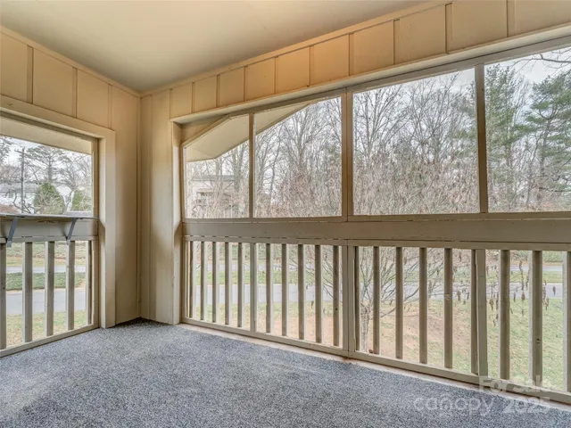 a view of a porch with wooden floor and outdoor space