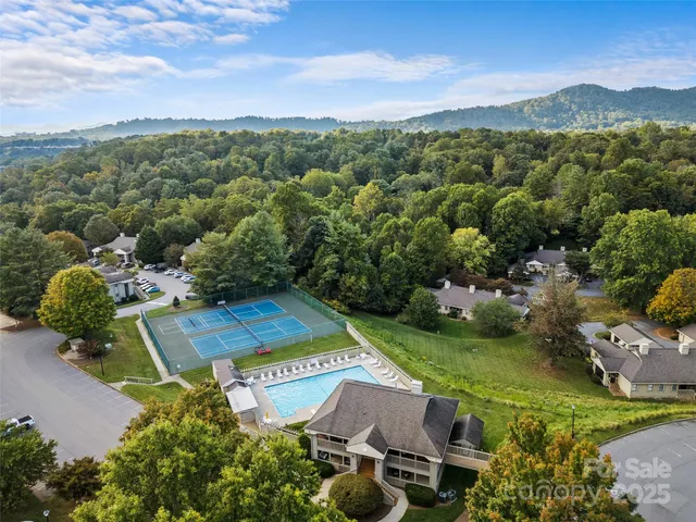 an aerial view of a house with a garden