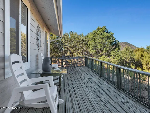a view of balcony with furniture