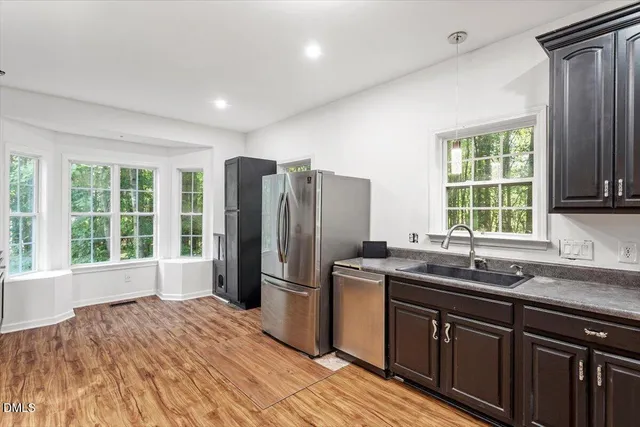 a kitchen with a stove and a refrigerator