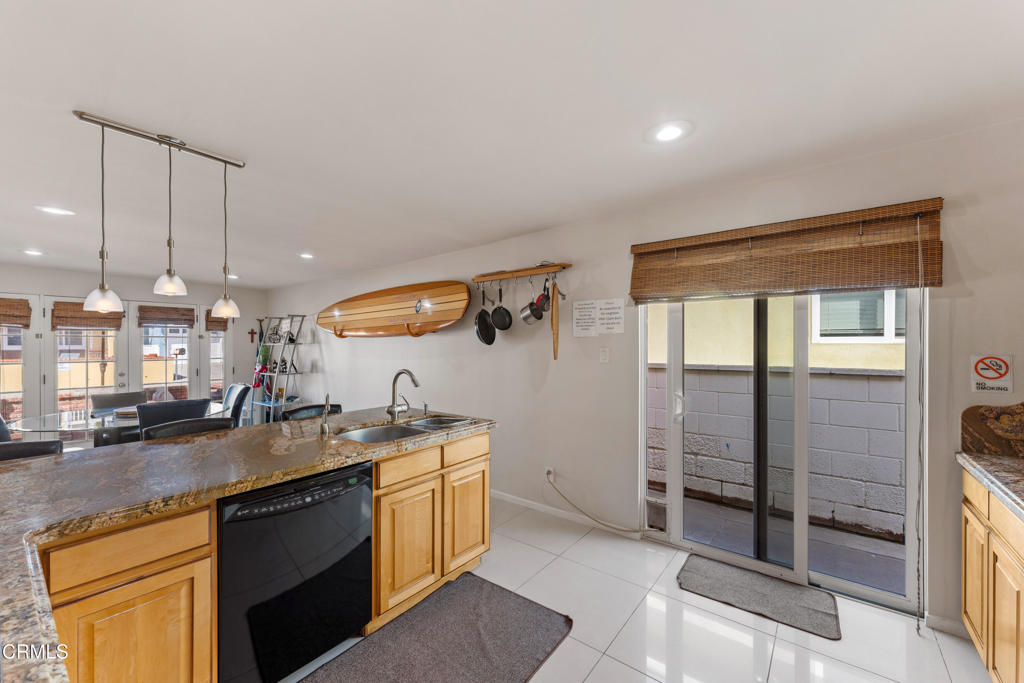 132 Ojai Avenue Oxnard, CA 93035 - Photo 12 of 25 a kitchen with stainless steel appliances granite countertop a sink and a stove