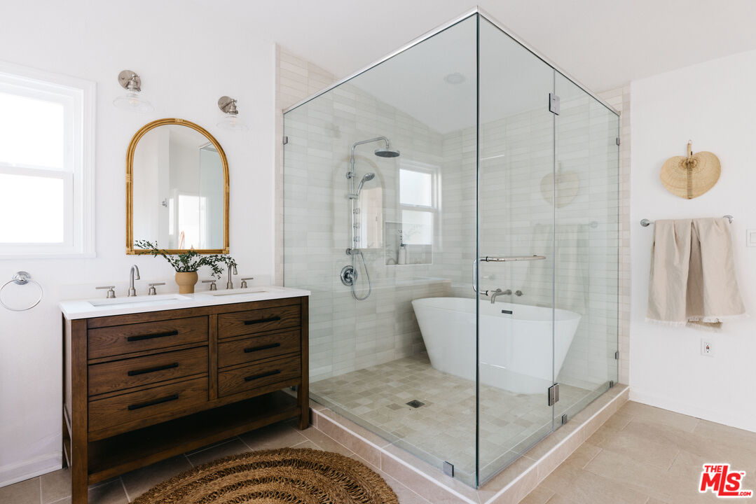 5907 Meridian Street Los Angeles, CA 90042 - Photo 16 of 27 a bathroom with a double vanity sink mirror and shower