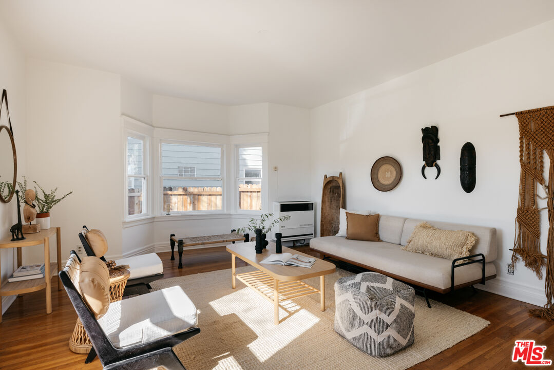 5907 Meridian Street Los Angeles, CA 90042 - Photo 2 of 27 a living room with furniture and a wooden floor