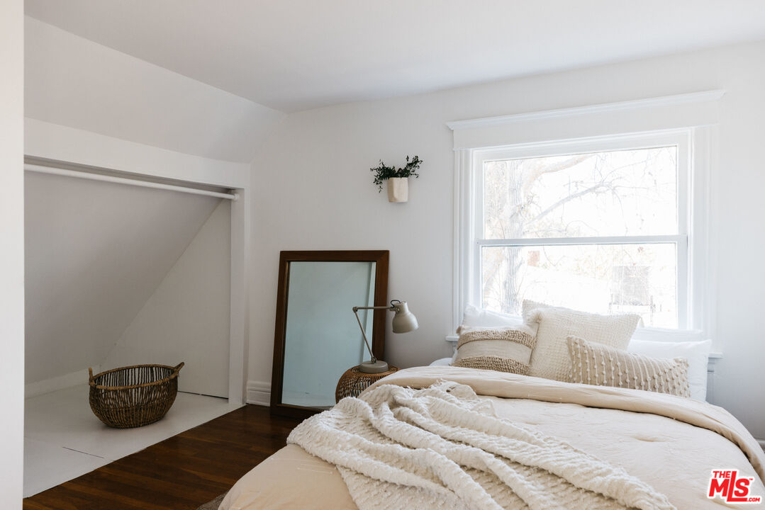 5907 Meridian Street Los Angeles, CA 90042 - Photo 22 of 27 a bedroom with a bed and a window