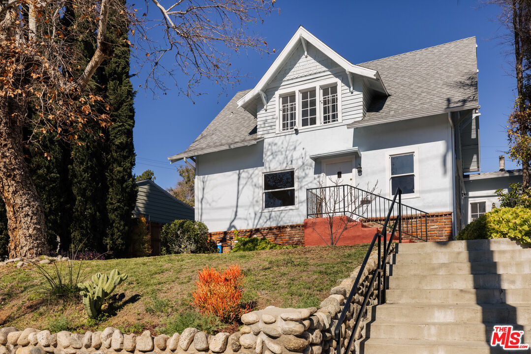 5907 Meridian Street Los Angeles, CA 90042 - Photo 23 of 27 a front view of a house with a yard