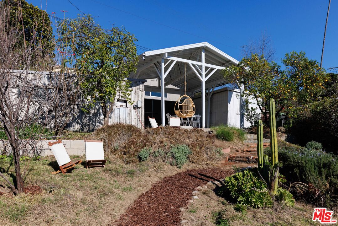 5907 Meridian Street Los Angeles, CA 90042 - Photo 24 of 27 a view of a house with a yard