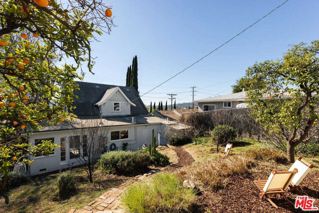 5907 Meridian Street Los Angeles, CA 90042 - Photo 25 of 27 a front view of a house with a yard