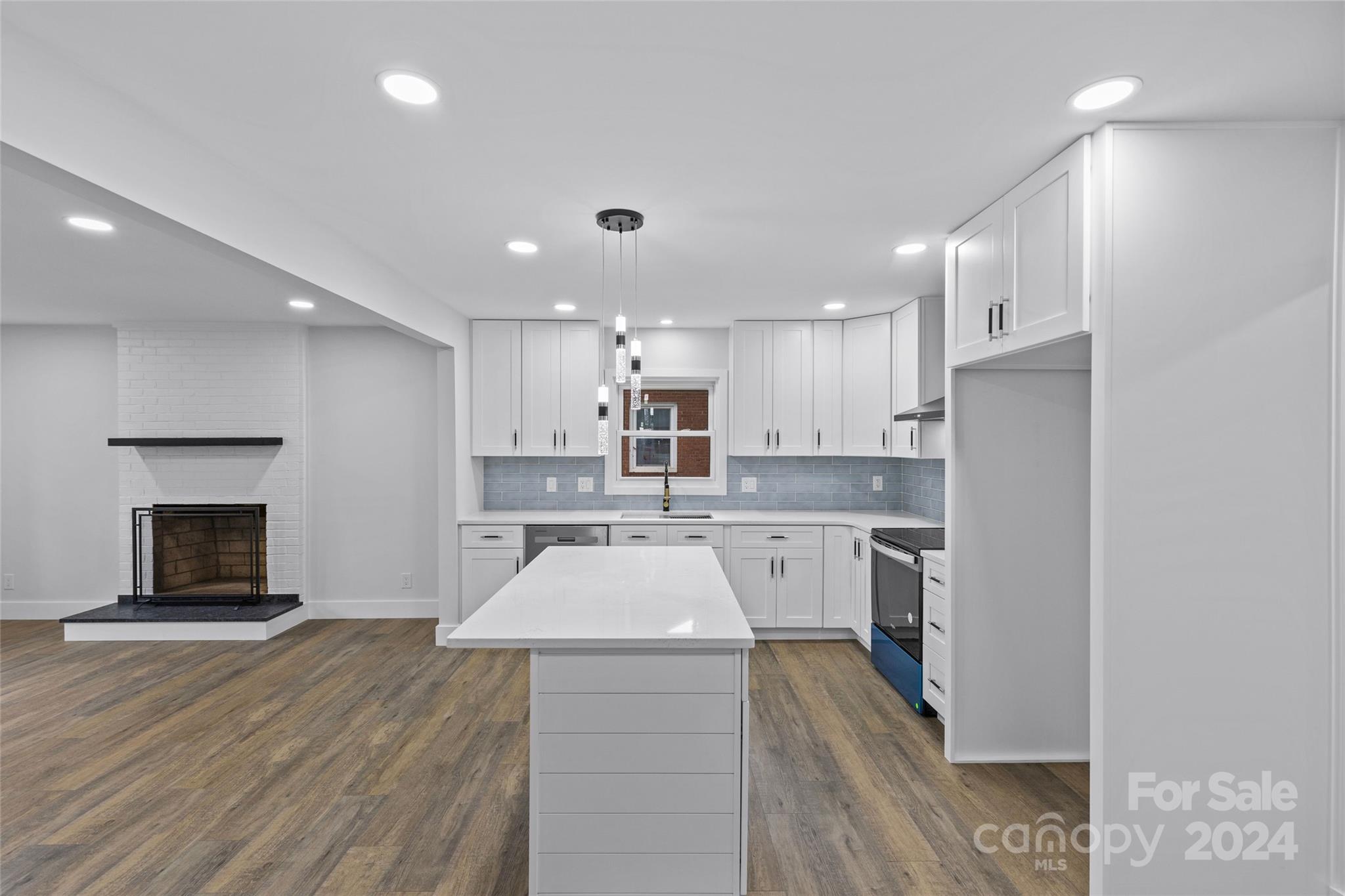 5745 Ruth Drive Charlotte, NC 28215 - Photo 11 of 42 a large kitchen with a large counter top appliances and cabinets