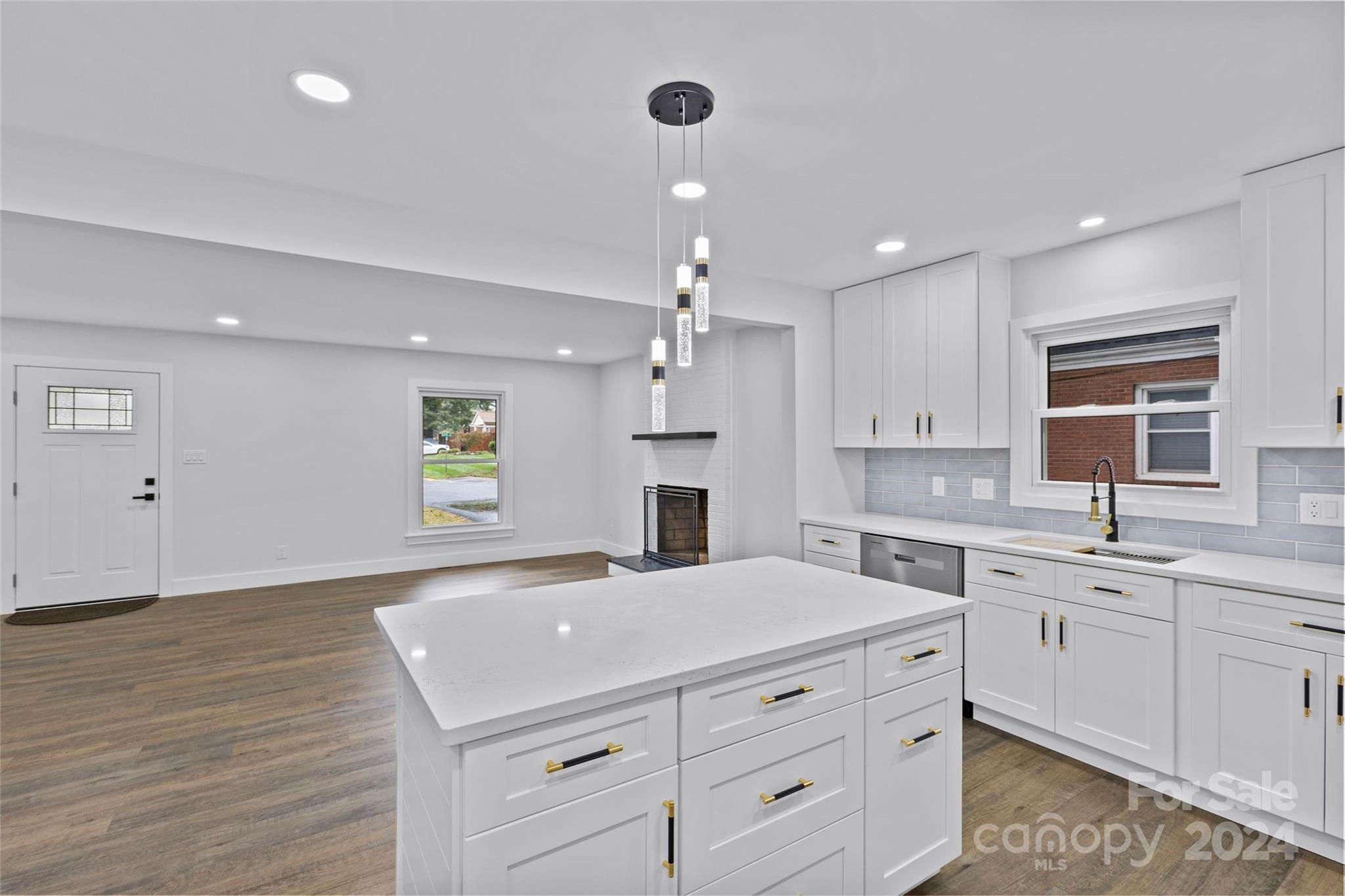5745 Ruth Drive Charlotte, NC 28215 - Photo 14 of 42 a kitchen with a sink stove and cabinets