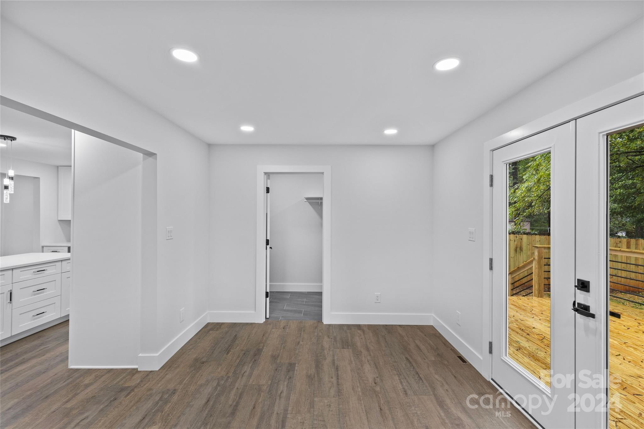 5745 Ruth Drive Charlotte, NC 28215 - Photo 19 of 42 wooden floor in an empty room with a window